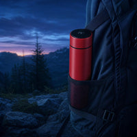 Dromy Bottle roja en mochila al atardecer